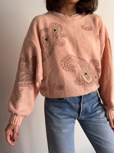 Maglione rosa con decorazioni